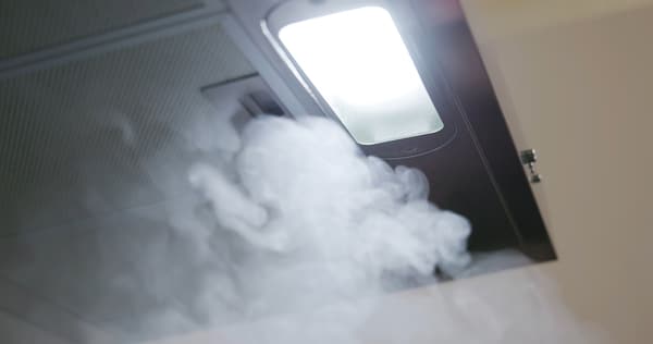 Smoke filtering into a range hood - iStock Credit: PonyWang